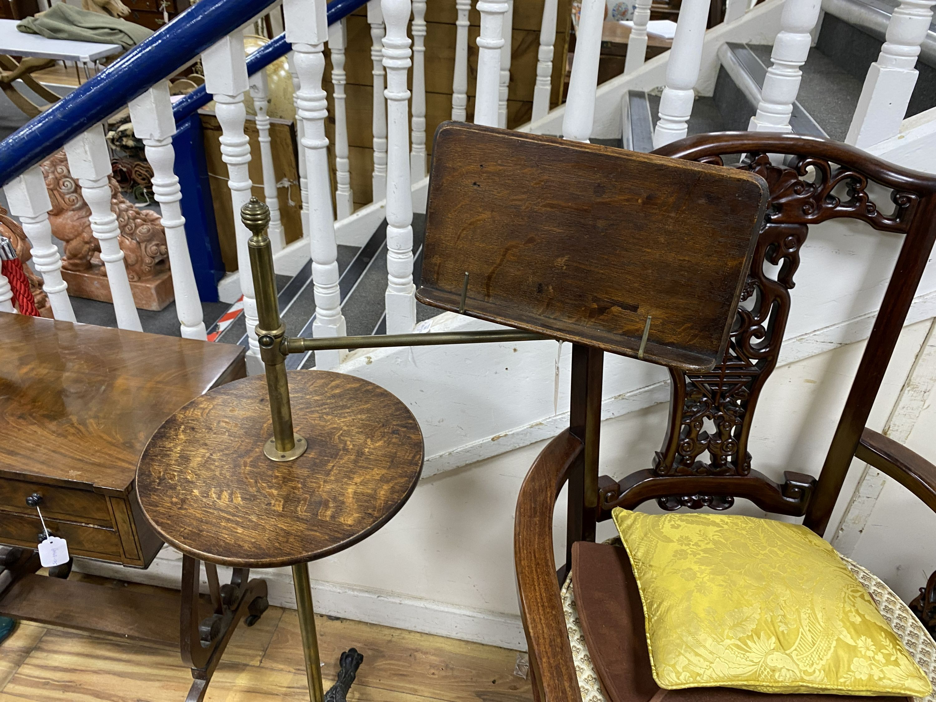 A late Victorian brass, oak and cast iron adjustable reading table